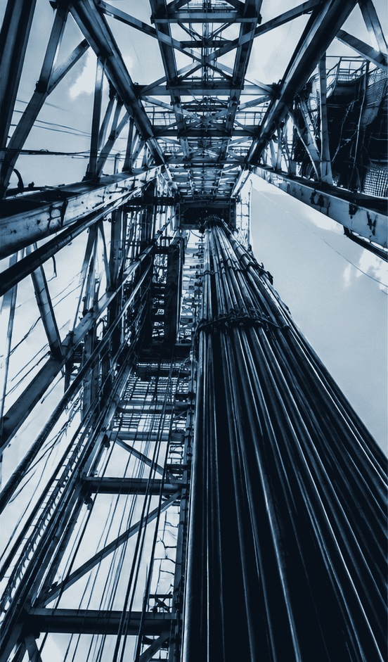 Looking upward through a drilling derrick